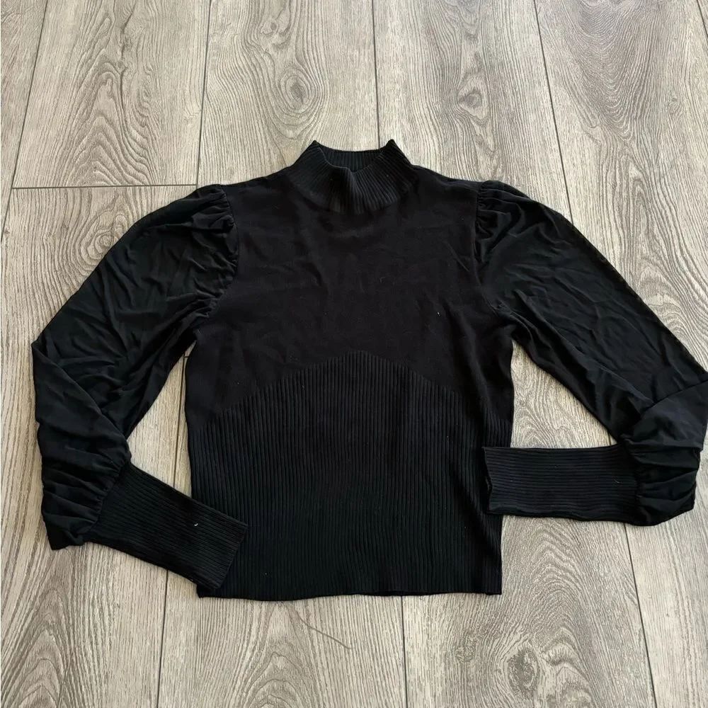 Almost famous woman’s used long sleeve shirt in good condition
